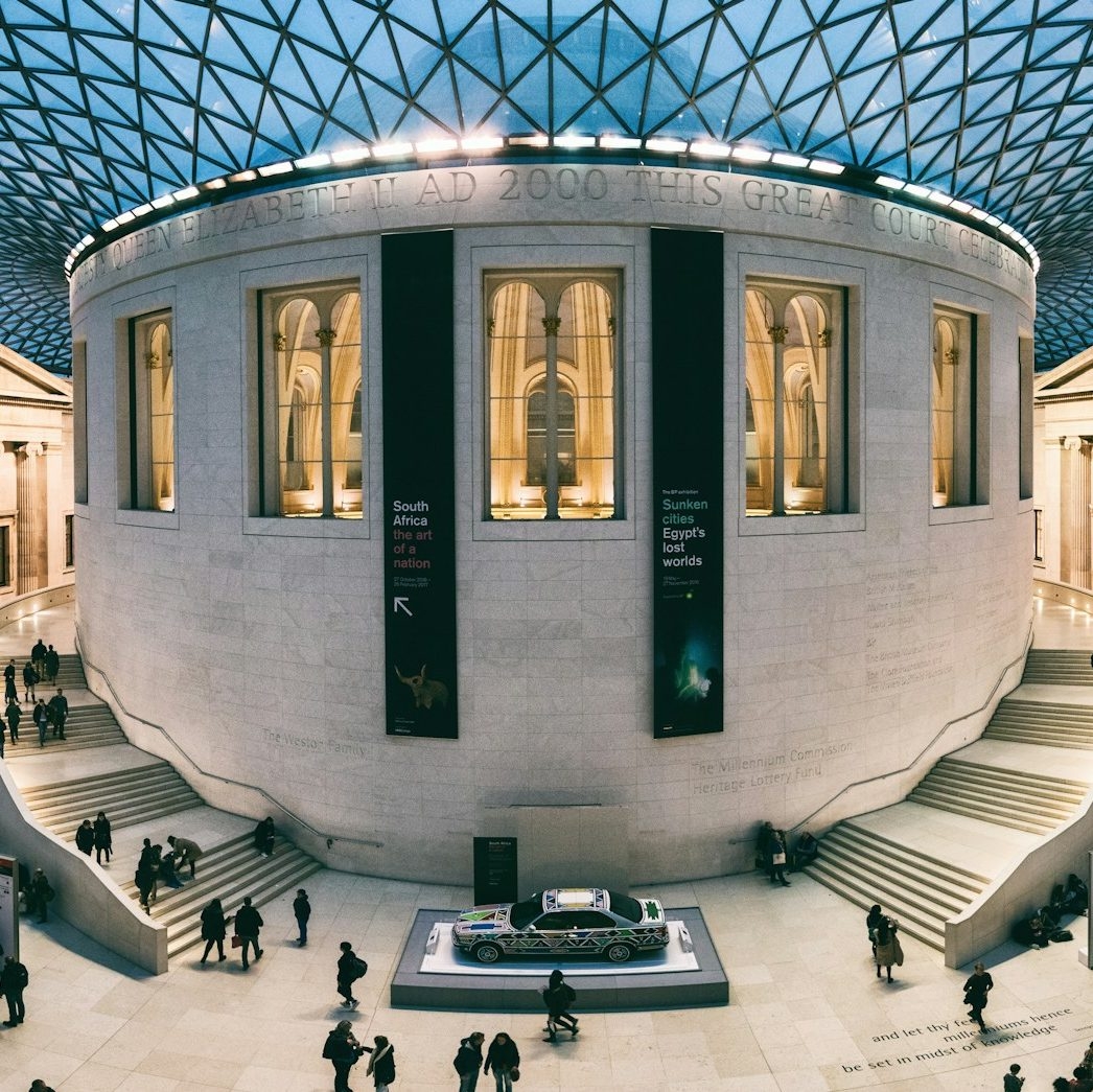 Exterior view of the British Museum, showcasing its iconic neoclassical facade with large stone columns, representing a landmark associated with Premier Support Services' facilities management expertise.